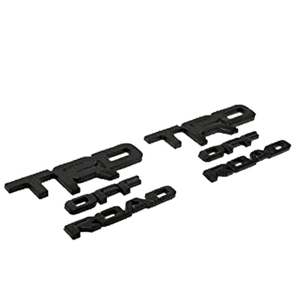 Matte black TRD OFF ROAD emblem set, includes two emblems.