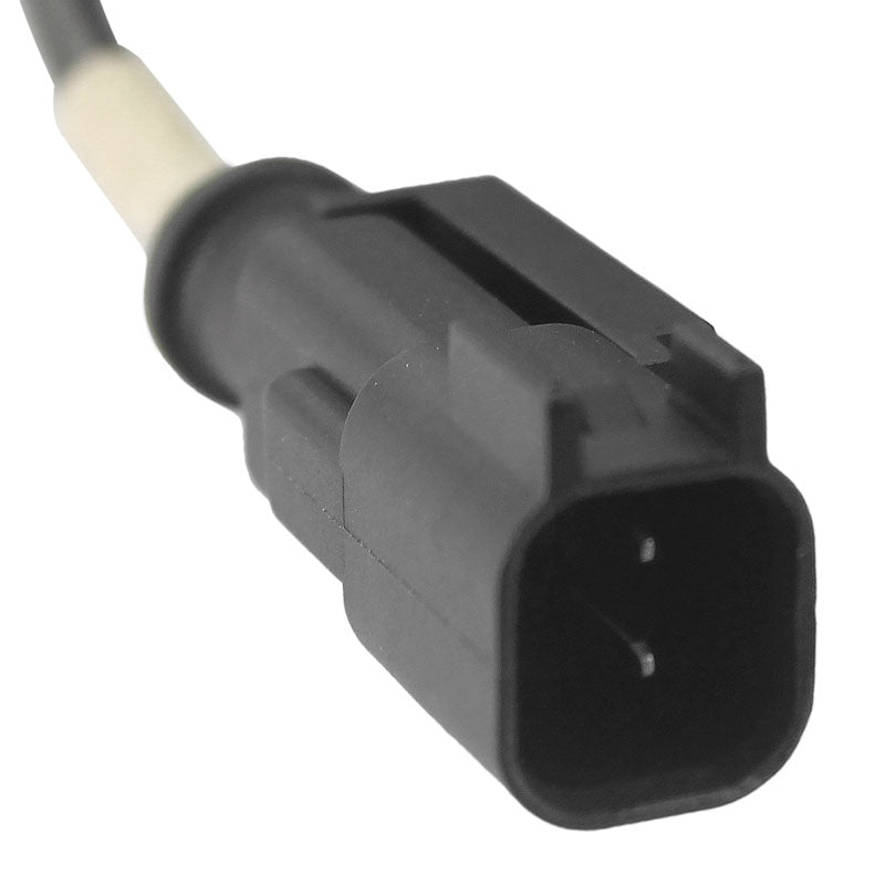 Automotive electrical connector with black plastic housing and white wire.