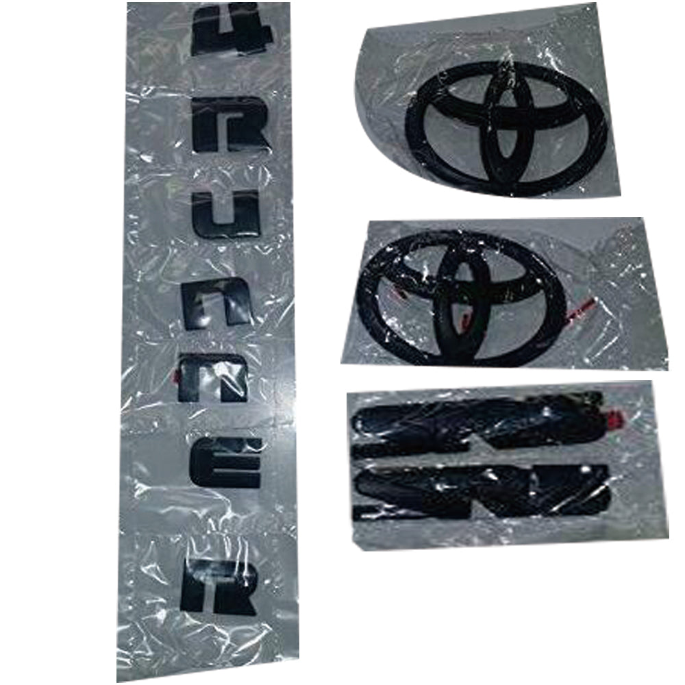 Black Toyota 4Runner emblem kit including two SR5 badges, two Toyota oval logos, and a set of '4Runner' letters.