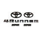 Black Toyota 4Runner emblem kit including two SR5 badges, two Toyota oval logos, and a set of '4Runner' letters.
