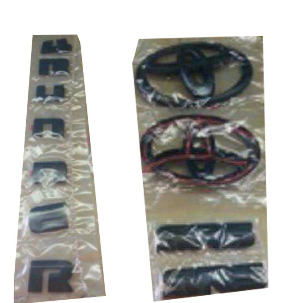 Black Toyota 4Runner emblem kit including two SR5 badges, two Toyota oval logos, and a set of '4Runner' letters.