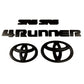 Black Toyota 4Runner emblem kit including two SR5 badges, two Toyota oval logos, and a set of '4Runner' letters.