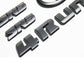 Black Toyota 4Runner emblem kit including two SR5 badges, two Toyota oval logos, and a set of '4Runner' letters.