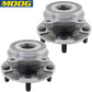 Two MOOG wheel hub assemblies in front of a yellow MOOG branded box with world map, automotive replacement parts.

