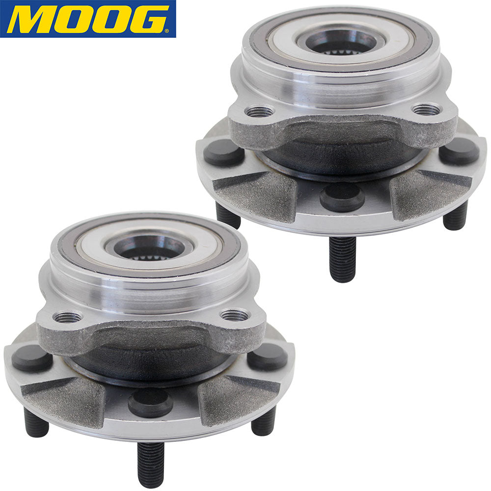 Two MOOG wheel hub assemblies in front of a yellow MOOG branded box with world map, automotive replacement parts.

