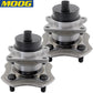 Two MOOG wheel hub assemblies with studs and ABS sensor, displayed in front of a yellow MOOG branded box, automotive replacement parts.

