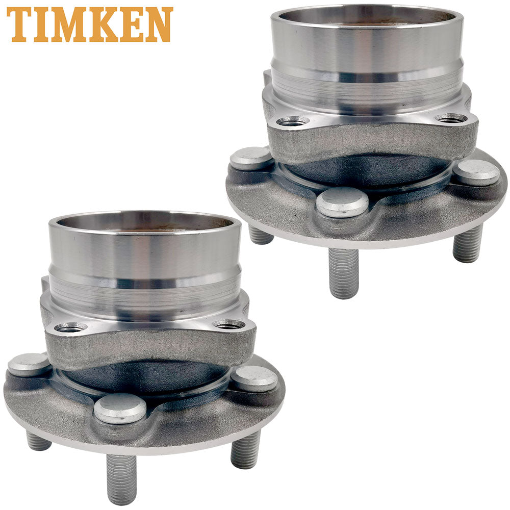 Two TIMKEN wheel hub assemblies with bearings and studs, displayed in front of an orange TIMKEN branded box, automotive replacement parts.

