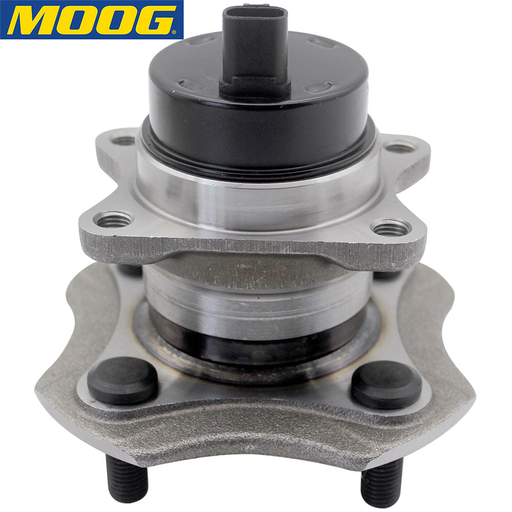 MOOG wheel hub assembly with ABS sensor, placed in front of a yellow MOOG branded box, automotive replacement part.

