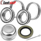 Trailer wheel bearing kit: two sets of tapered roller bearings, grease cap, rubber seal, and cotter pin. Silver bearings, black seal, and metal cap visible.